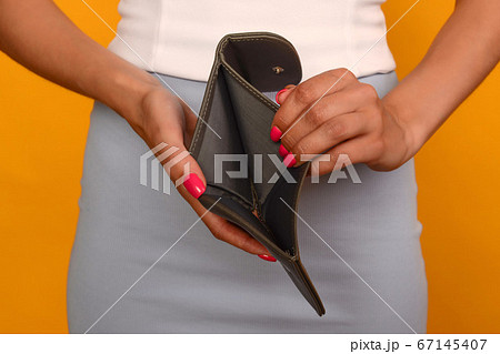 Young woman shows her empty wallet. Bankruptcy Young woman shows her empty wallet. Bankruptcy 67145407