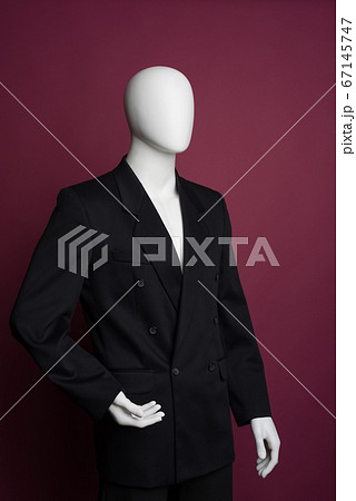 White male mannequin in a black business suit on a 67145747