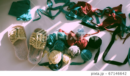 Top view colorful scene in sunlight morning, ball of yarn from recycle old t shirt Top view colorful scene in sunlight morning, ball of yarn from recycle old t shirt 67146642
