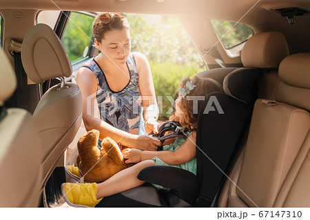 Cute little baby child sitting in car seat. Portrait of cute little baby child sitting in car seat.Safety concept. Cute little baby child sitting in car seat. Portrait of cute little baby child sitting in car seat.Safety concept. 67147310
