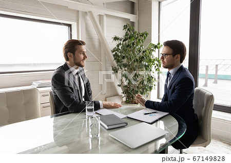 Caucasian businessmen talk discuss collaboration at office meeting 67149828