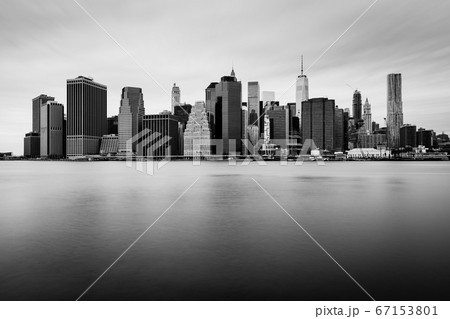 Manhattan downtown skyline in cloudy day, black and white colors, New York, USA Manhattan downtown skyline in cloudy day, black and white colors, New York, USA 67153801
