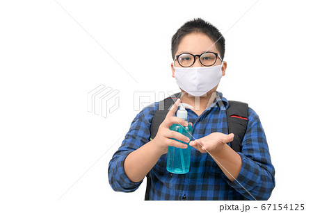 Asian boy student wear mask holding alcohol gel 67154125