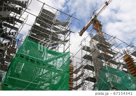 KUALA LUMPUR, MALAYSIA -JULY 29, 2019: Scaffolding is installed on the construction site as temporary support for high level construction. Installed according to specifications to ensure workers safet 67154341