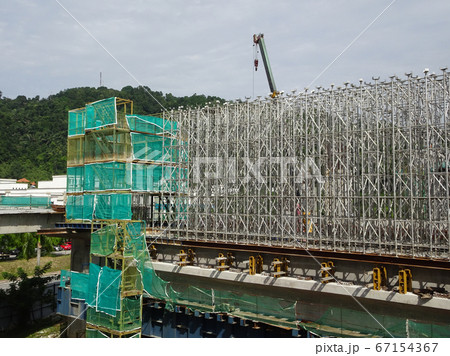 KUALA LUMPUR, MALAYSIA -JULY 29, 2019: Scaffolding is installed on the construction site as temporary support for high level construction. Installed according to specifications to ensure workers safet 67154367