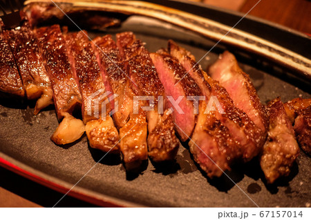 Medium rare meat on plate in the restaurant Medium rare meat on plate in the restaurant 67157014
