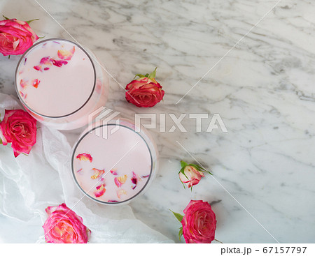 Moon milk prepares with pink rose flower. Trendy 67157797