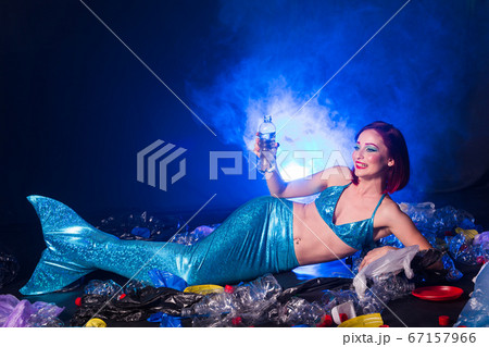 Ocean Pollution, Rubbish in the Water. Stupid Fairytale Mermaid in