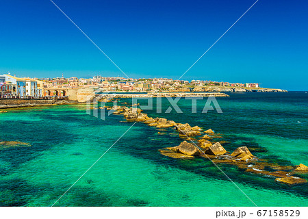 Syracuse, Sicily. Beautiful view of the Ionian Sea coastline in Ortigia, Italy Syracuse, Sicily. Beautiful view of the Ionian Sea coastline in Ortigia, Italy 67158529