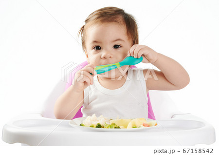 Pretty baby girl with spoon Pretty baby girl with spoon 67158542