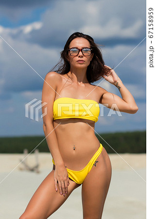 Beautiful woman in swimsuit on beach Beautiful woman in swimsuit on beach 67158959