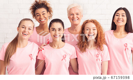 Ladies Smiling Wearing T-Shirts With Pink Ribbon On White Background 67159398
