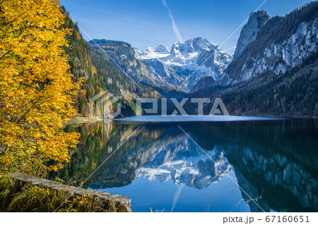 Autumn scenery with Dachstein mountain at sunrise in fall 67160651