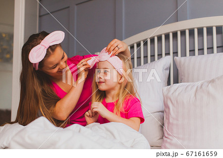 Mom and daughter are engaged in their beauty after waking up Mom and daughter are engaged in their beauty after waking up 67161659