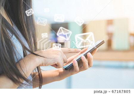 Close-up image of female hands using smartphone 67167805