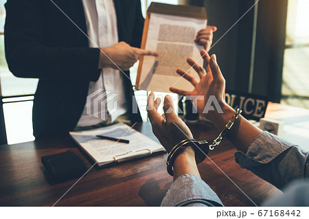 The police officer pointed to the document The police officer pointed to the document 67168442