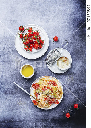 Traditional Italian pasta with tomato, zucchini Traditional Italian pasta with tomato, zucchini 67176397