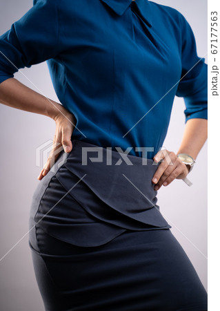 Body shape of woman in blue shirt posing showing Body shape of woman in blue shirt posing showing 67177563