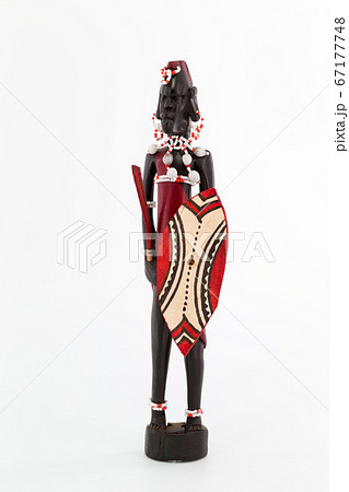 Wooden figure of a Maasai man on white background Wooden figure of a Maasai man on white background 67177748