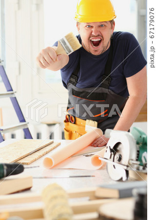 Arm of smiling worker hold brush portrait 67179076