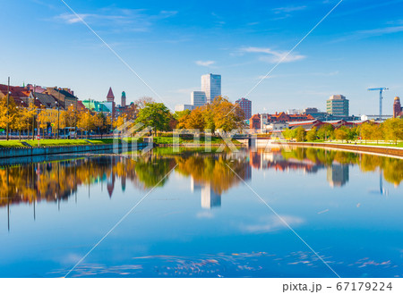 Malmo, Sweden: skyline reflected in the water, urban landscape panorama Malmo, Sweden: skyline reflected in the water, urban landscape panorama 67179224
