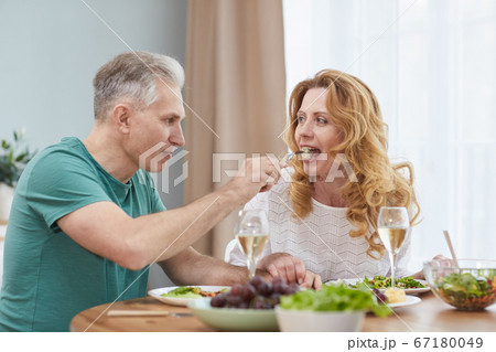 Mature Couple Enjoying Romantic Dinner Mature Couple Enjoying Romantic Dinner 67180049