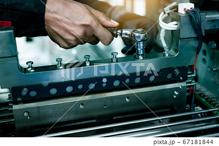Mechanic technician hand fixing industrial 67181844