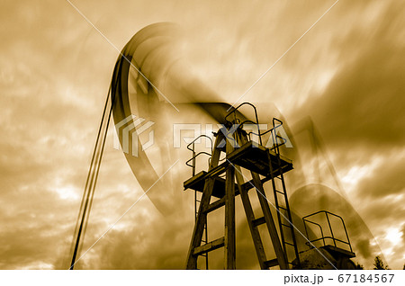 Petroleum concept. Oil pump rig. Oil and gas production. Oilfield site. Pump Jack are running. Drilling derricks for fossil fuels output and crude oil production. Global crisis. War on oil prices. Petroleum concept. Oil pump rig. Oil and gas production. Oilfield site. Pump Jack are running. Drilling derricks for fossil fuels output and crude oil production. Global crisis. War on oil prices. 67184567