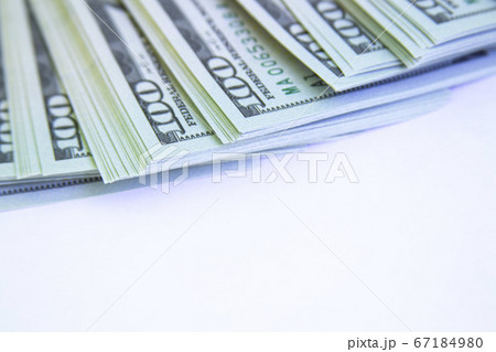 A lot of one hundred dollar bills isolated on white.copyspace for text. A lot of one hundred dollar bills isolated on white.copyspace for text. 67184980