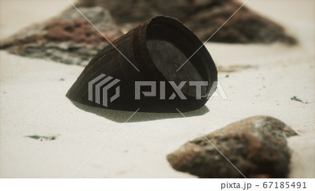 Old wooden barrel on the beach 67185491