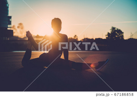 Active Healthy Female Prepares for Evening Yoga.  67186858