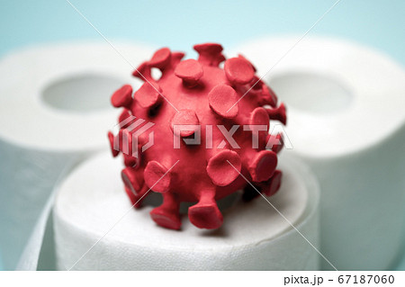 Red model of coronavirus on the toilet paper roll 67187060