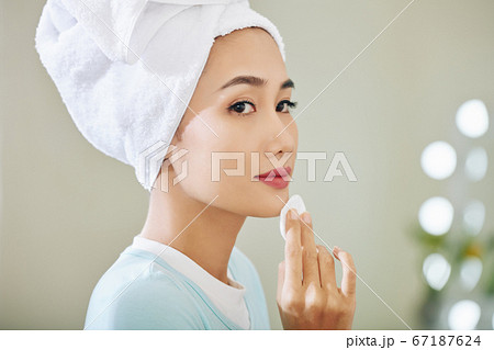 Woman applying face toner 67187624