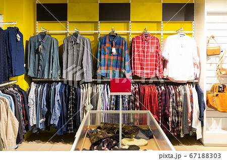 clothing store with a large assortment of shirts clothing store with a large assortment of shirts 67188303