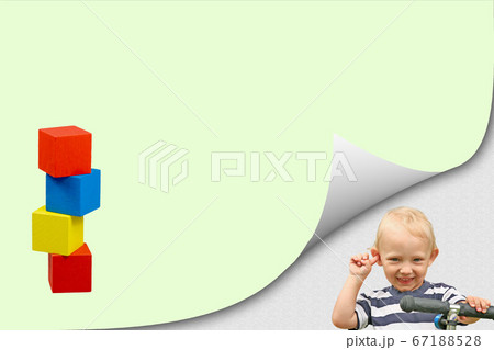 Smiling blond boy with tower of wooden color toys Smiling blond boy with tower of wooden color toys 67188528