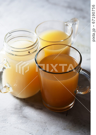 Homemade Beef Bone Broth in Glasses on a gray 67190756