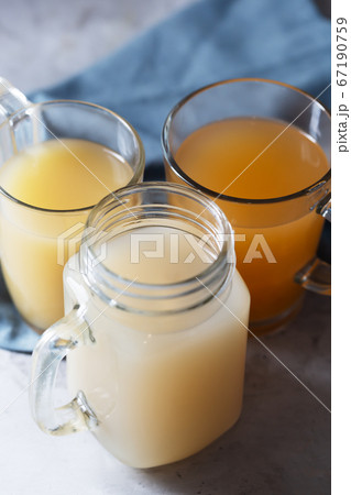 Homemade Beef Bone Broth in Glasses on a gray 67190759