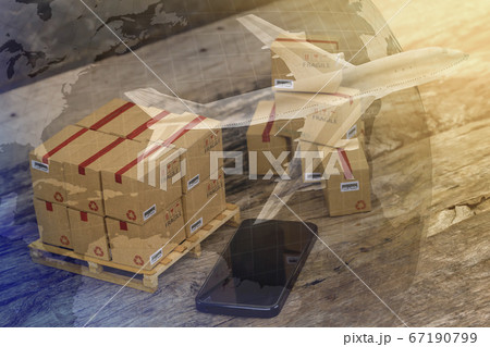 Packing boxes small goods and cell phone with a plane flies above world map. business concept about transportation, global shipping, international freight, overseas trade, regional, services remotely. 67190799