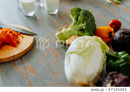 Fresh vegetables on table in kitchen Fresh vegetables on table in kitchen 67193093