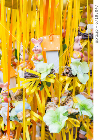 Funny Easter rabbits figurines in a market Funny Easter rabbits figurines in a market 67195047