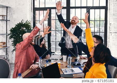 Group of joyful smiling happy people celebrate win with arms up. Mediation offer high five friendship deal achievement strike bargain good news friendly consent successful effective strategy Group of joyful smiling happy people celebrate win with arms up. Mediation offer high five friendship deal achievement strike bargain good news friendly consent successful effective strategy 67195101