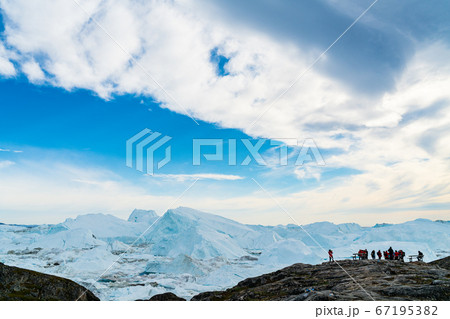 Icebergs in arctic landscape nature with travel tourists in Greenland 67195382