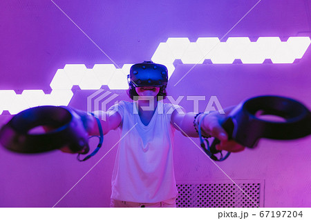 Girl playing virtual reality games. Home entertainment. 67197204