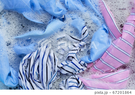 Color clothes soak in powder detergent water 67201864