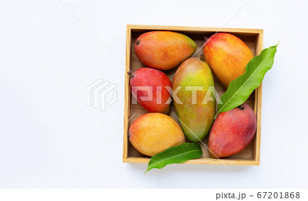 Tropical fruit, Mango in wooden box on white 67201868
