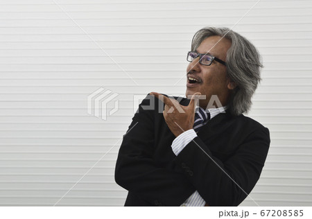 Happy elderly asian businessman in black suit and 67208585