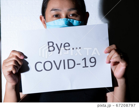 Light shining on Asian woman holding a paper 67208797