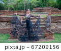 Woman wearing typical thai dress with thai style, Beauty fantasy Thai dress traditional costume on brick in old temple 67209156