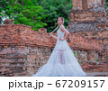 Woman wearing typical thai dress with thai style, Beauty fantasy Thai dress traditional costume on brick in old temple 67209157