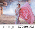 Woman wearing typical thai dress with thai style, Beauty fantasy Thai dress traditional costume on brick in old temple 67209158